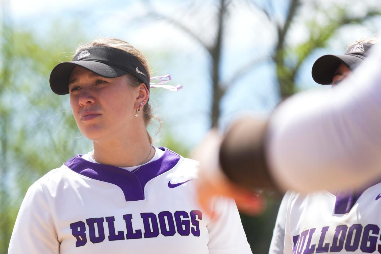 Brownsburg Bulldogs Macy Twomey (11) huddles with her team during the Carmel Softball Invitational on Saturday, April 20, 2024, at the Cherry Tree Softball Complex in Carmel, Indiana.
