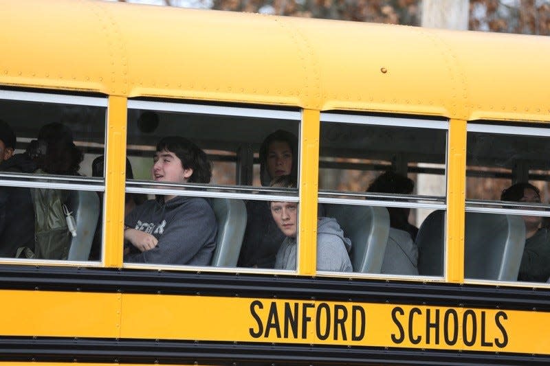 Police rushed to Sanford High School in Maine Tuesday morning, Nov. 15, 2022, for what they say was a hoax report of a shooting there and at schools around the state. Students were being evacuated as part of a lockdown process as a precaution.