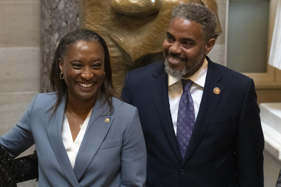 Sen. Laphonza Butler, D-Calif., left, reacts after being sworn into the Congressional Black Caucus by Rep. Steven Horsford, D-Nev., right, in front of a statue of Rosa Parks in the Hall of Statuary on Capitol Hill, Tuesday, Oct. 3, 2023 in Washington. (AP Photo/Mark Schiefelbein)