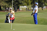 Hideki Matsuyama, right,of Japan, reacts after missing a hit for birdie on the sixth green of the Silverado Resort North Course during the final round of the Fortinet Championship PGA golf tournament Sunday, Sept. 19, 2021, in Napa, Calif. (AP Photo/Eric Risberg)