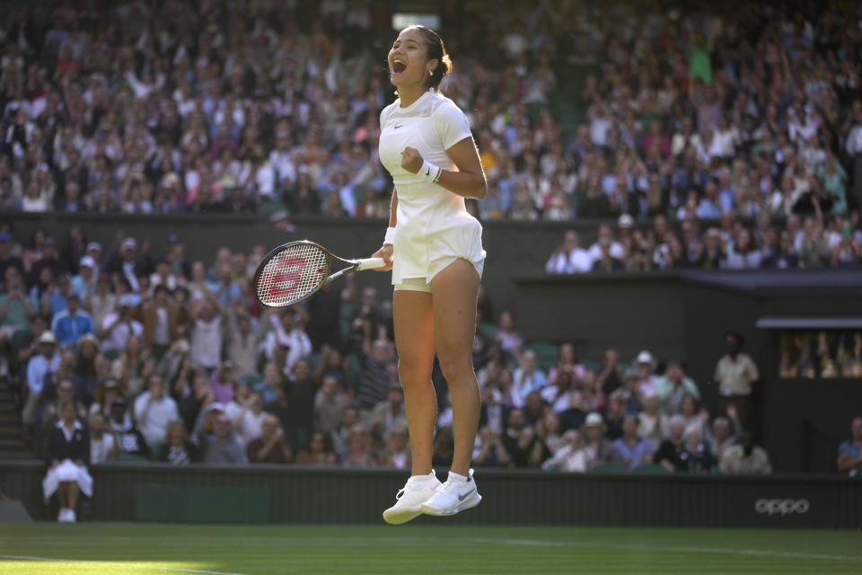 Britain's Emma Raducanu celebrates beating Belgium's Alison van Uytvanck to win a women's first round singles match on day one of the Wimbledon tennis championships in London, Monday, June 27, 2022. (AP Photo/Kirsty Wigglesworth)