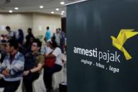 People wait to register for the government's tax amnesty program inside a tax office in Jakarta, Indonesia September 30, 2016. REUTERS/Iqro Rinaldi