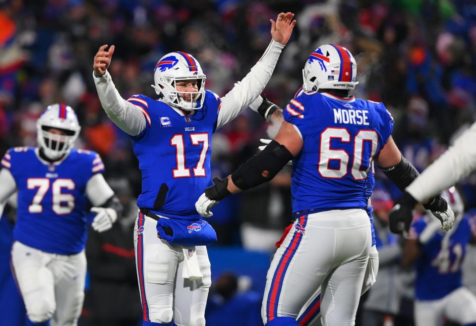 Buffalo Bills quarterback Josh Allen celebrates a touchdown pass with center Mitch Morse during the second half against the New England Patriots.