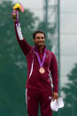 LONDON, ENGLAND - JULY 31: Bronze medalist Nasser Al-Attiya of Qatar poses on the podium during the medal ceremony for the during the Men's Skeet Shooting final round on Day 4 of the London 2012 Olympic Games at The Royal Artillery Barracks on July 31, 2012 in London, England. (Photo by Lars Baron/Getty Images)