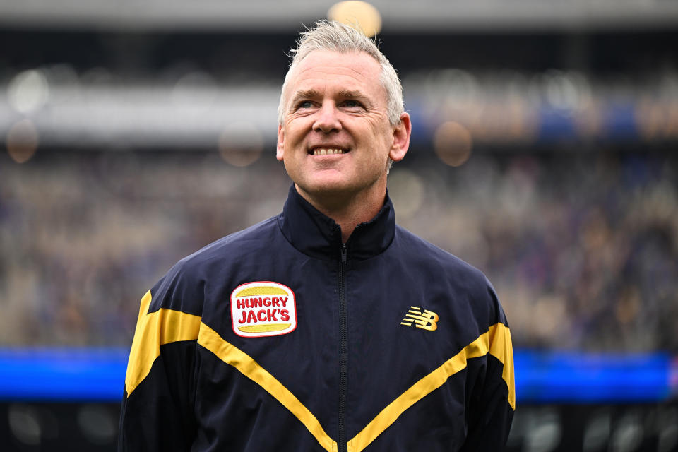 PERTH, AUSTRALIA - JULY 14: Adam Simpson, Senior Coach of the Eagles is interviewed before the bounce during the 2024 AFL Round 18 match between the West Coast Eagles and the Brisbane Lions at Optus Stadium on July 14, 2024 in Perth, Australia. (Photo by Daniel Carson/AFL Photos via Getty Images)