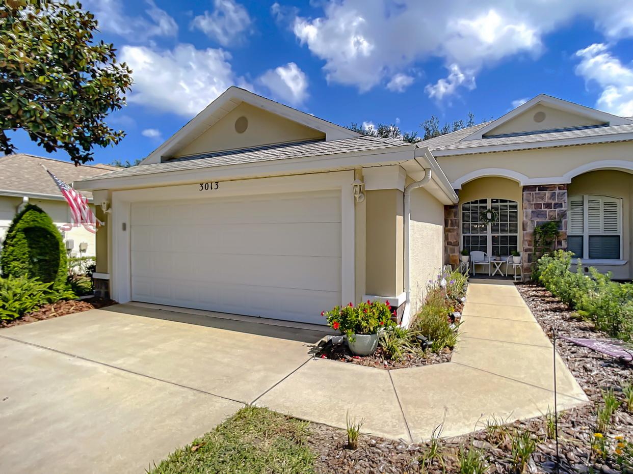 Stone exterior accents hint to the stunning interior that awaits in this Ormond Beach townhome.