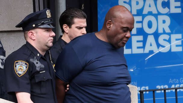 PHOTO: Frank James, the suspect in the Brooklyn subway shooting, is escorted from an NYPD precinct in Manhattan, New York, April 13, 2022.  (Stephen Yang/Reuters, FILE)