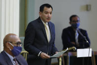 FILE - In this June 15, 2020, file photo, Assembly Speaker Anthony Rendon, D-Lakewood, urges lawmakers to approve the state budget bill, at the Capitol in Sacramento, Calif. A coronavirus outbreak in the California Legislature has indefinitely delayed the state Assembly's return to work from a scheduled summer recess. Rendon's office confirmed five people who work in the Assembly have tested positive for the coronavirus. They include Assemblywoman Autumn Burke, who is believed to have contracted the virus while on the Assembly floor last month. (AP Photo/Rich Pedroncelli, File)
