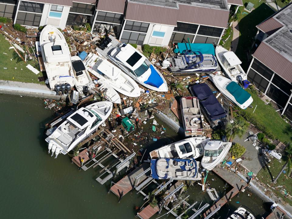Battered boats are seen in the aftermath of Hurricane Ian, Thursday, Sept. 29, 2022, in Fort Myers Beach, Fla.