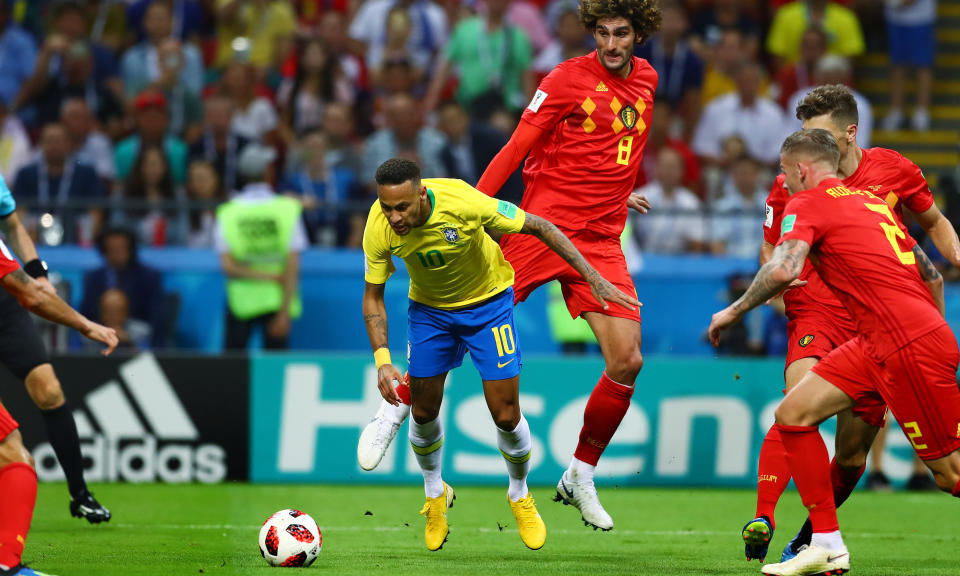  Neymar goes to ground from minimal contact in the area during Brazil's clash with Belgium. (Rex)