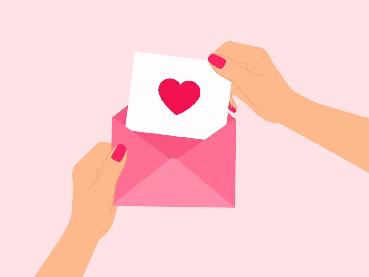 Hands holding open a love letter.  (Getty Images)