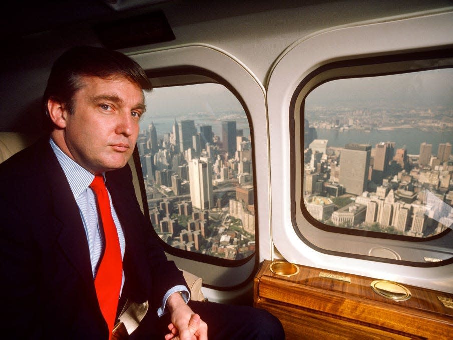 Donald Trump in 1987, flying aboard his Puma helicopter from NYC to Atlantic City.