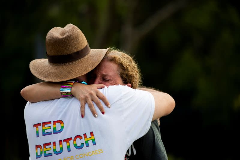 Rep. Debbie Wasserman Schultz is comforted after a truck drove into a crowd of people during The Stonewall Pride Parade and Street Festival