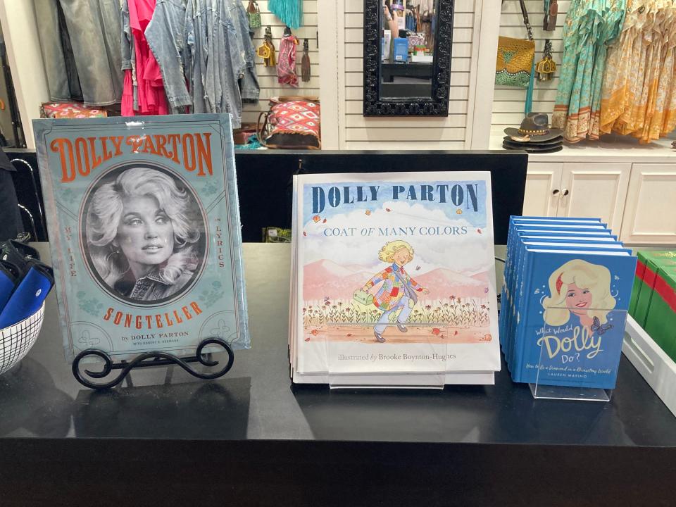 Dolly Parton books displayed on a counter for sale at Dollywood.