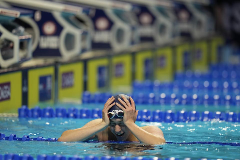 Jake Mitchell reacts after his lone men's 400 freestyle qualifying heat during wave 2 of the U.S. Olympic Swim Trials on Tuesday, June 15, 2021, in Omaha, Neb. (AP Photo/Jeff Roberson)