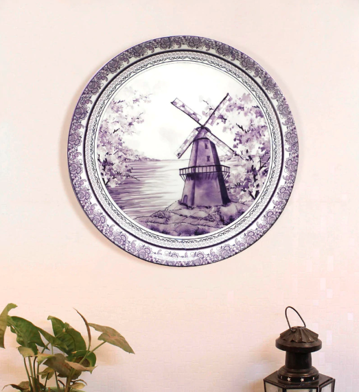 In classic blue and white, this 7.5-inch, <a href="https://fave.co/2XZse1m" rel="noopener" target="_blank" data-ylk="slk:bone china wall plate by Kolorobia;elm:context_link;itc:0;sec:content-canvas" class="link "><strong>bone china wall plate by Kolorobia</strong></a> showcases delftware that's typical of Dutch and English earthenware. <em>Rs.1,199 on offer. </em><a href="https://fave.co/2XZse1m" rel="noopener" target="_blank" data-ylk="slk:Flash sale!;elm:context_link;itc:0;sec:content-canvas" class="link "><strong>Flash sale!</strong></a>