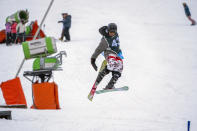 Sekholo Ramonotsi, 13, competes in the Winter Whip Slopestyle snowboard and ski competition at the Afriski ski resort near Butha-Buthe, Lesotho, Saturday July 30, 2022. Ramonotsi won banish ski and snowboard categories in his class. While millions across Europe sweat through a summer of record-breaking heat, Afriski in the Maluti Mountains is Africa's only operating ski resort south of the equator. It draws people from neighboring South Africa and further afield by offering a unique experience to go skiing in southern Africa. (AP Photo/Jerome Delay)