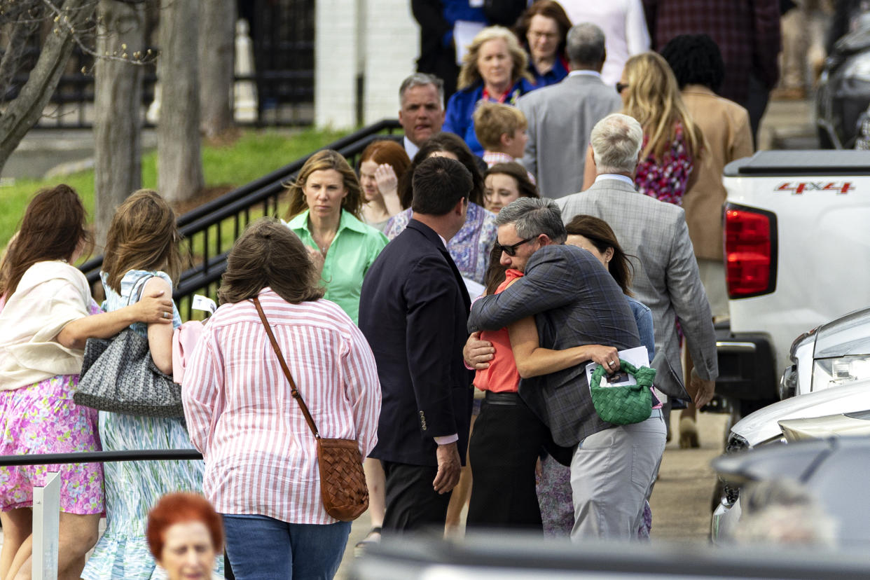 Mourners embrace after a funeral service held for The Covenant School shooting victim Evelyn Dieckhaus at the Woodmont Christian Church Friday, March 31, 2023, in Nashville, Tenn. (Wade Payne / AP)