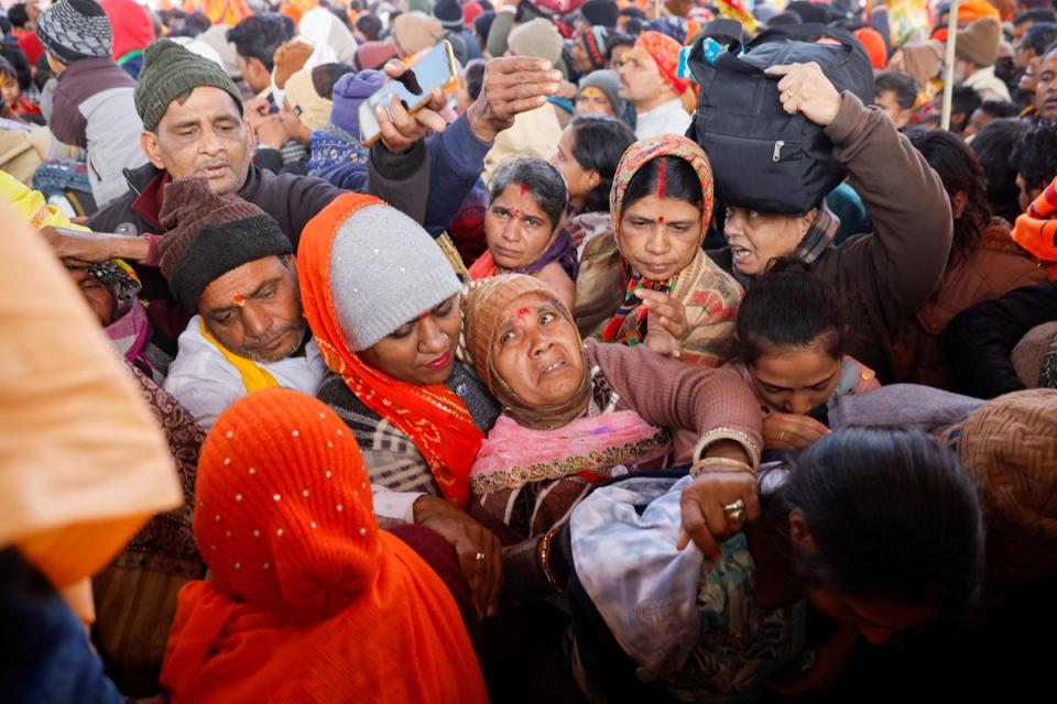 Some devotees fell during the surge of people trying to get inside (Reuters)