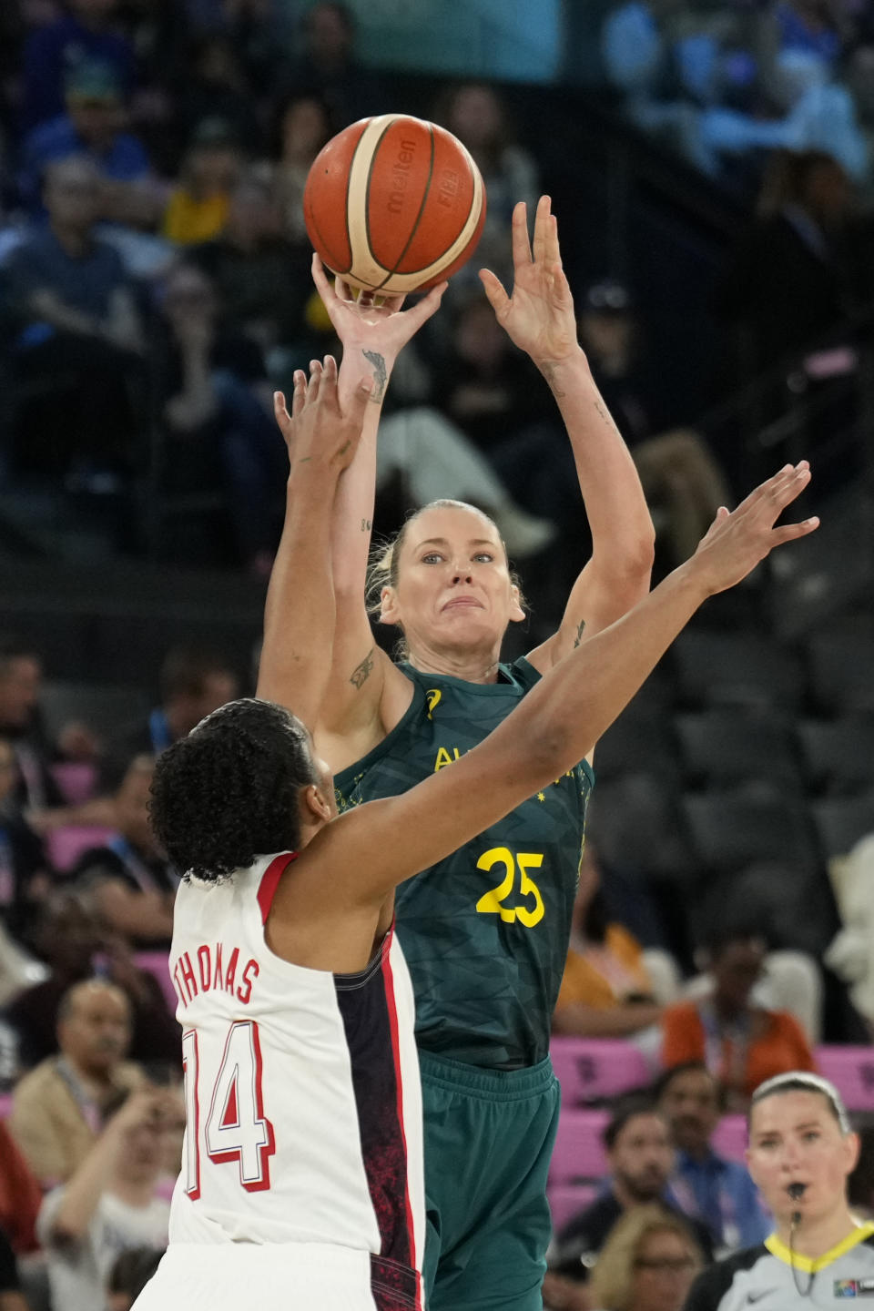 Lauren Jackson (25), of Australia, shoots over United States' Alyssa Thomas (14) during a women's semifinal basketball game at Bercy Arena at the 2024 Summer Olympics, Friday, Aug. 9, 2024, in Paris, France. (AP Photo/Mark J. Terrill)