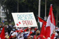A supporter of presidential candidate Keiko Fujimori holds up a sign that reads in Spanish: "Resist Peru" during a protest against alleged election fraud, in Lima, Peru, Saturday, June 12, 2021. Supporters are hoping to reverse the results of the June 6th presidential runoff election that seem to have given the win to opponent Pedro Castillo amid unproven claims of possible vote tampering. (AP Photo/Guadalupe Pardo)