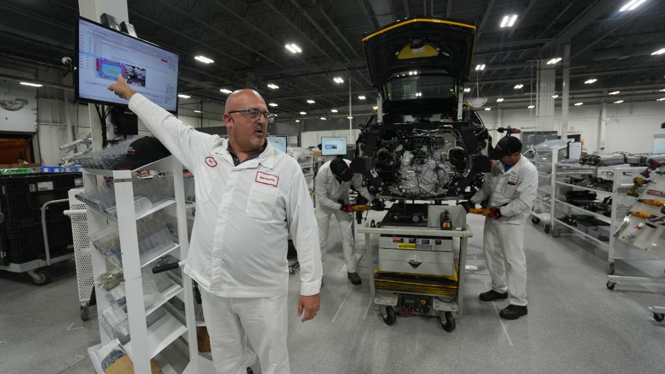 During a media tour of the Performance Manufacturing Center where the Acura NSX is made, Gary Barnes points out how each bolt and part of the car is logged on a computer program so that no mistakes are made in the creation of an Acura NSX.