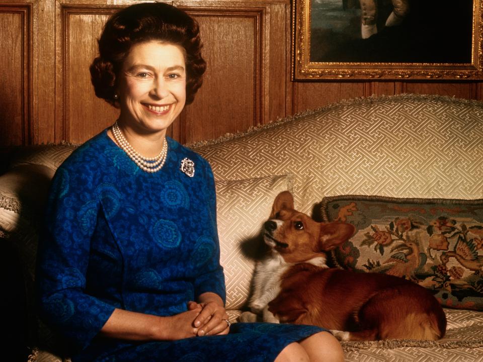 Queen Elizabeth posing with a corgi on February 04, 1970.