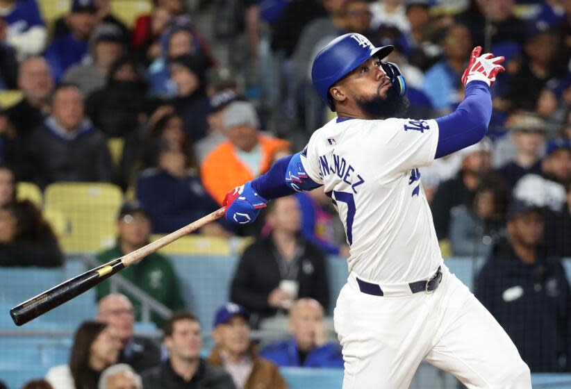 LOS ANGELES, CALIFORNIA - MARCH 29: Dodgers Teoscar Hernandez hits a solo home run.