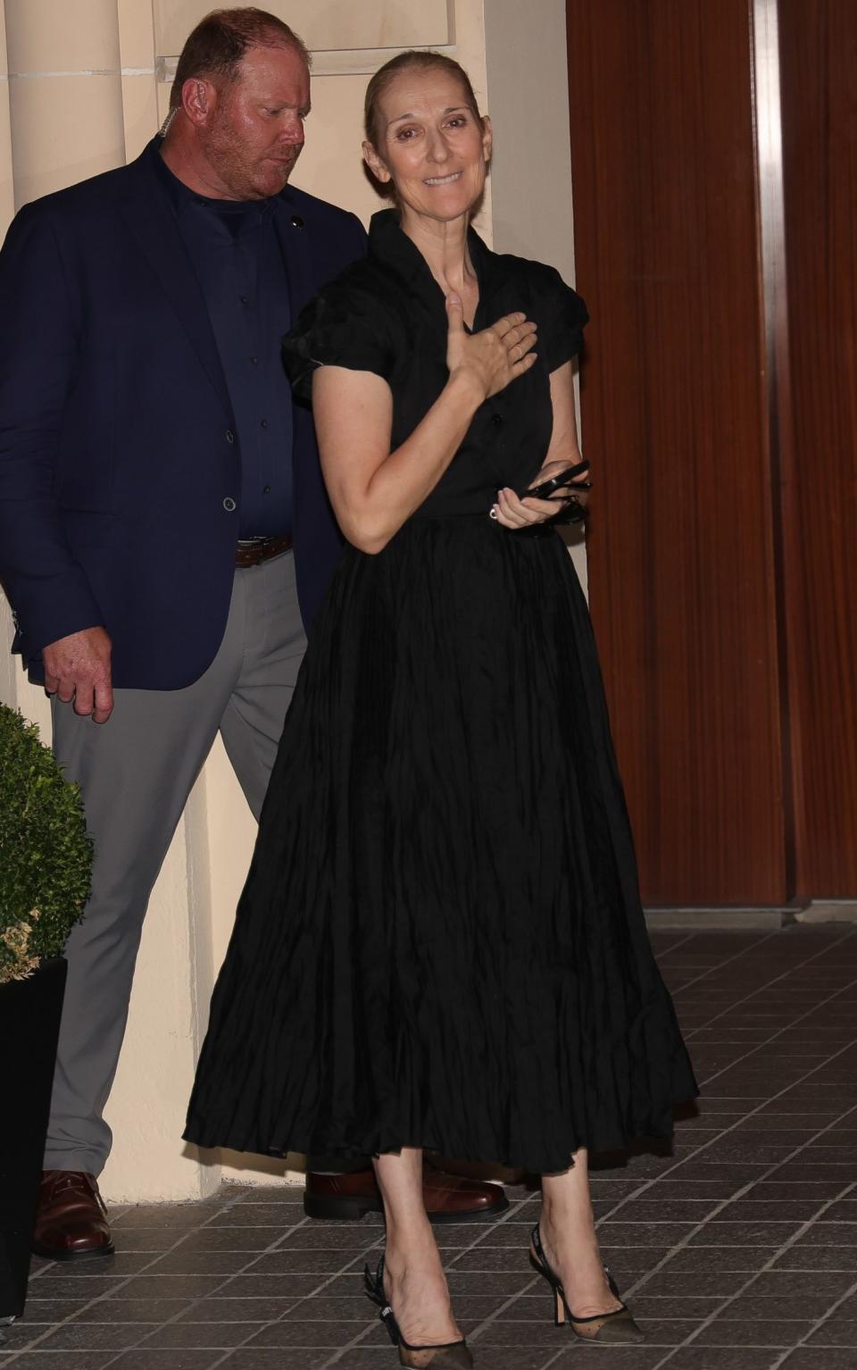 Celine Dion in Paris in a black maxi shirt dress