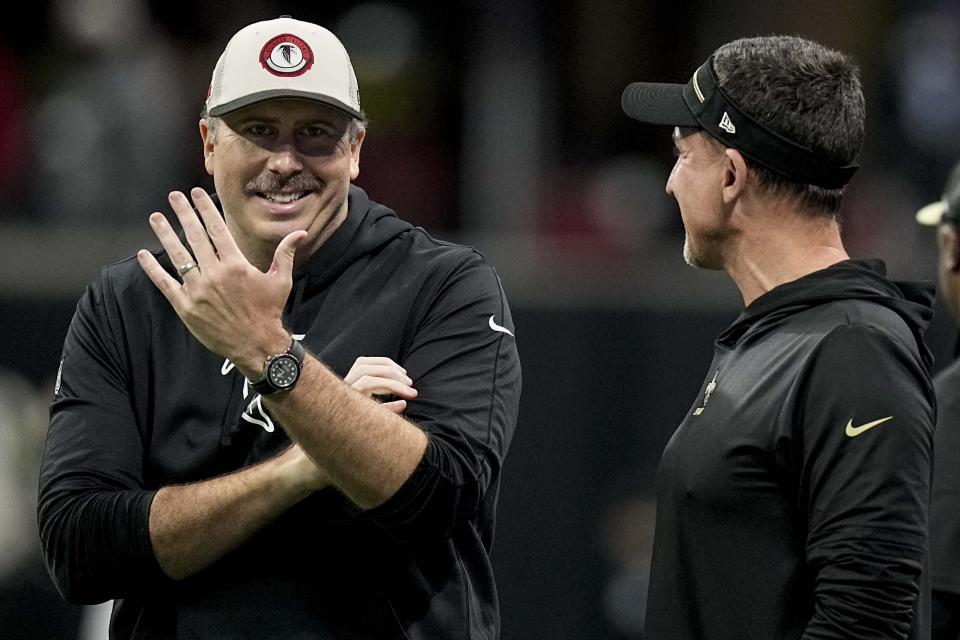 Atlanta Falcons head coach Arthur Smith speaks with New Orleans Saints head coach Dennis Allen before an NFL football game, Sunday, Nov. 26, 2023, in Atlanta. (AP Photo/Brynn Anderson)