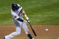 Milwaukee Brewers' Jacob Nottingham hits an RBI double during the eighth inning of a baseball against the Kansas City Royals game Saturday, Sept. 19, 2020, in Milwaukee. (AP Photo/Morry Gash)