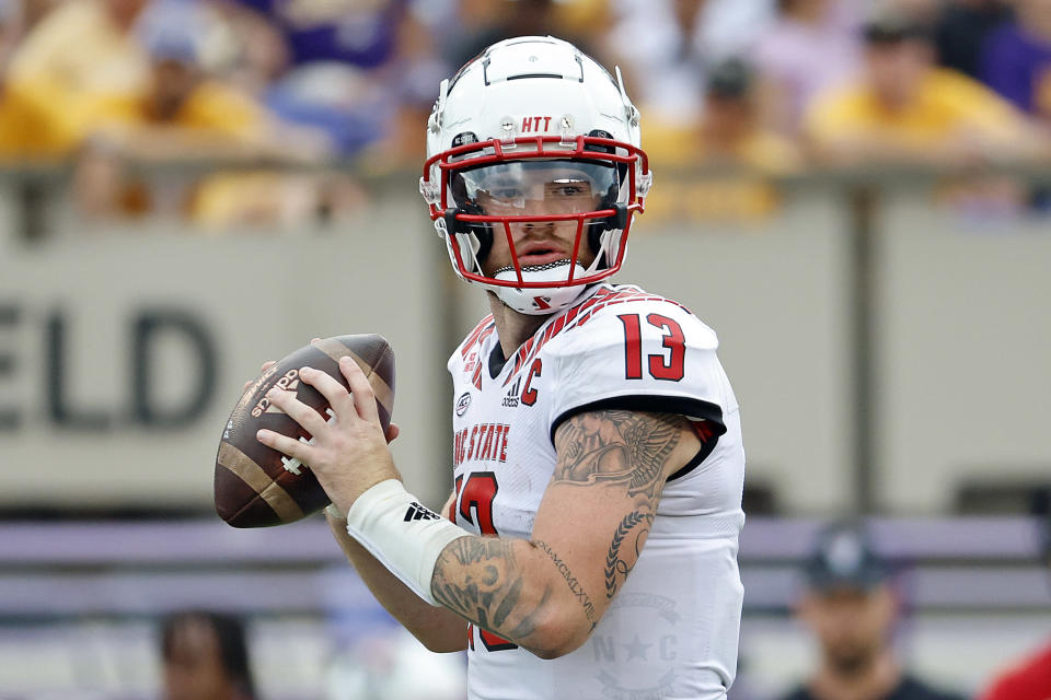 North Carolina State's Devin Leary (13) looks to pass the ball against East Carolina during the second half of an NCAA college football game in Greenville, N.C., Saturday, Sept. 3, 2022. (AP Photo/Karl B DeBlaker)