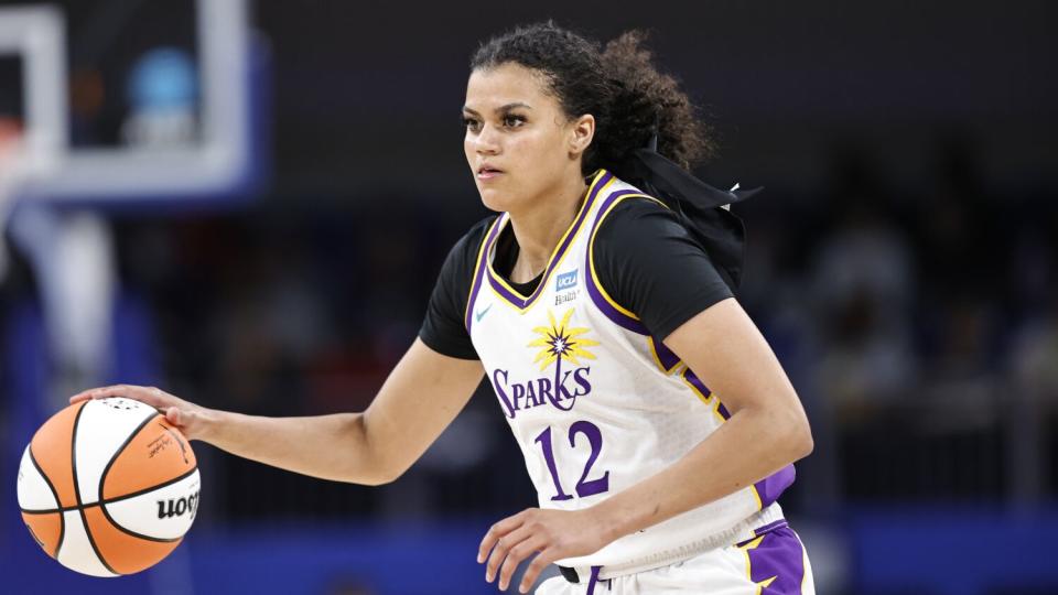 Sparks guard Rae Burrell brings the ball up court duirng a WNBA game last season.