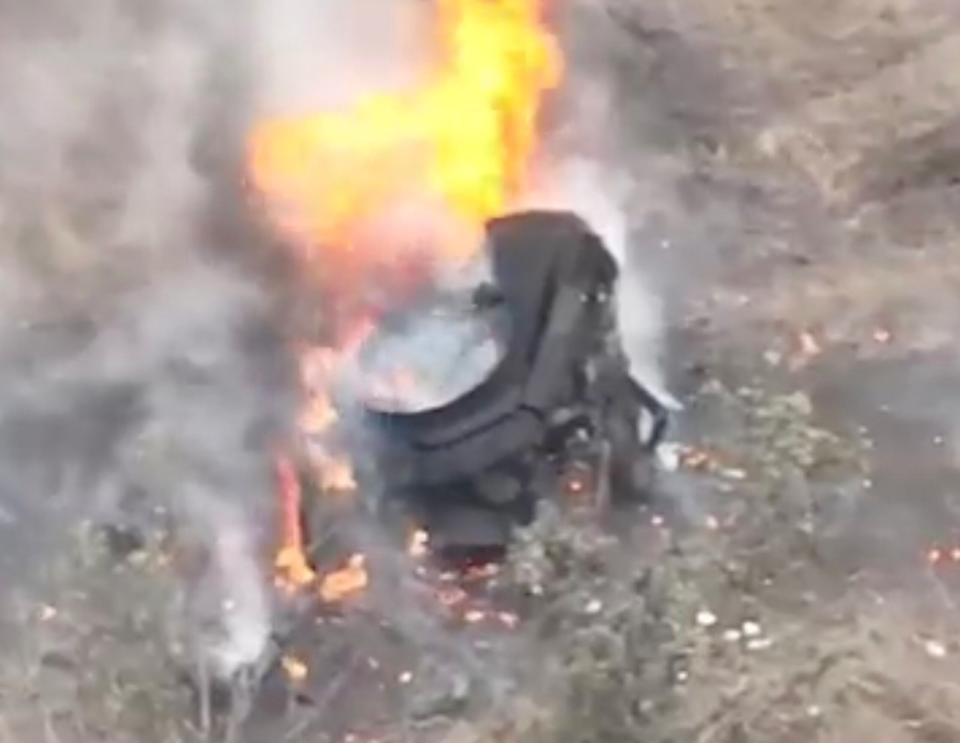 Smoldering remains of the T-90M, minus its turret. <em>Twitter/X screen cap</em>