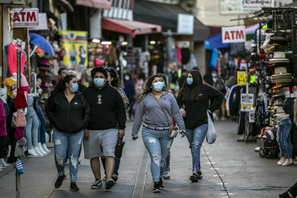 Los Angeles, CA, Friday, February 19, 2021 - Shoppers walk along Santee Alley late in the afternoon downtown.  (Robert Gauthier/Los Angeles Times via Getty Images)