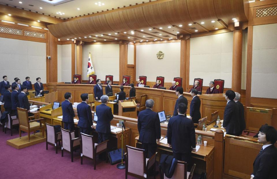 Nine judges of the Constitutional Court sit during a hearing on whether to confirm the impeachment of President Park Geun-Hye at the court Thursday, Jan. 5, 2017, in Seoul, South Korea. (Jung Yeon-Je/Pool Photo via AP)