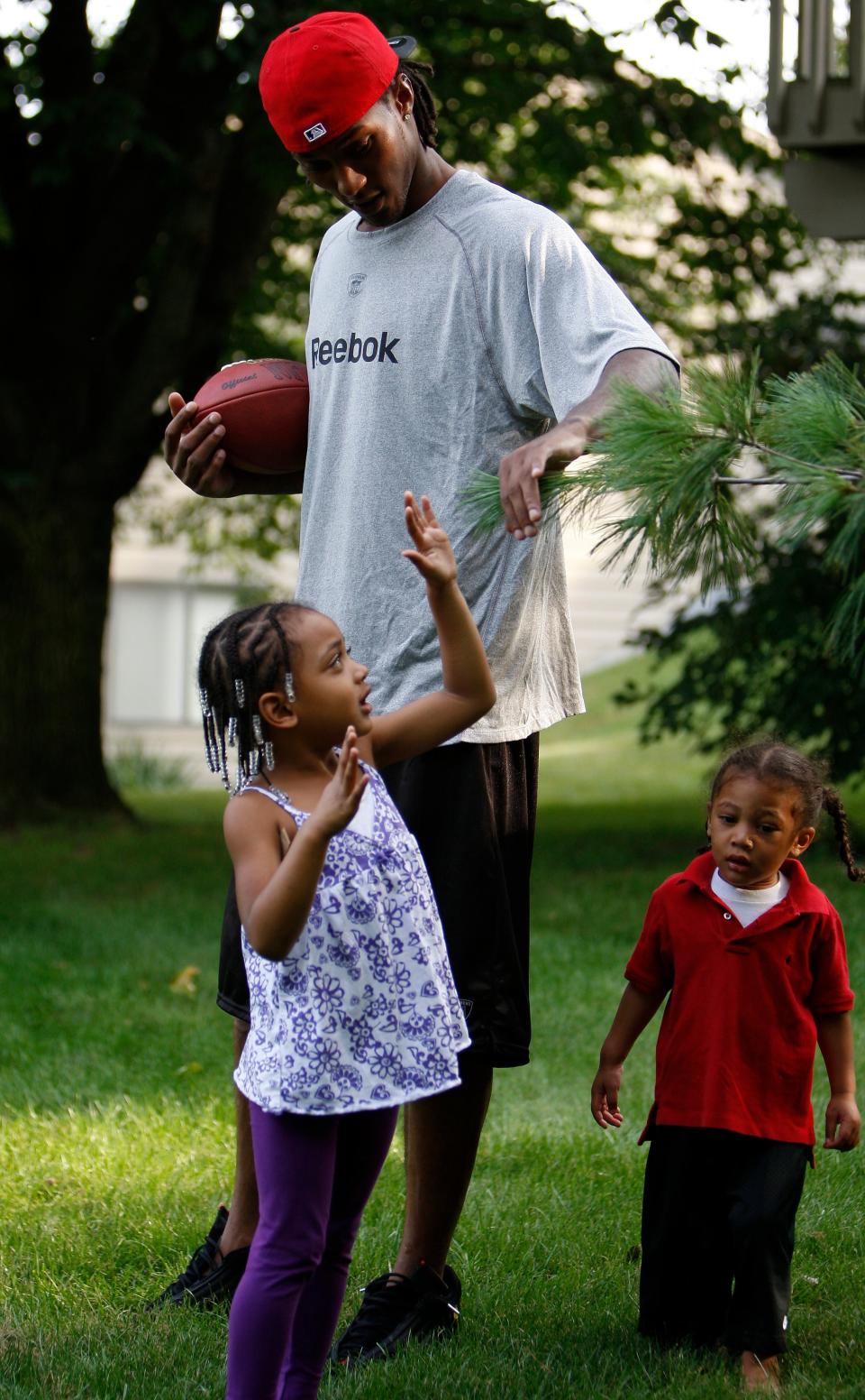 Chris Henry plays with his kids Seini, 3 and Chris Jr., 2 or (ManMan) as they call him at their Wyoming home Tuesday September 15, 2009