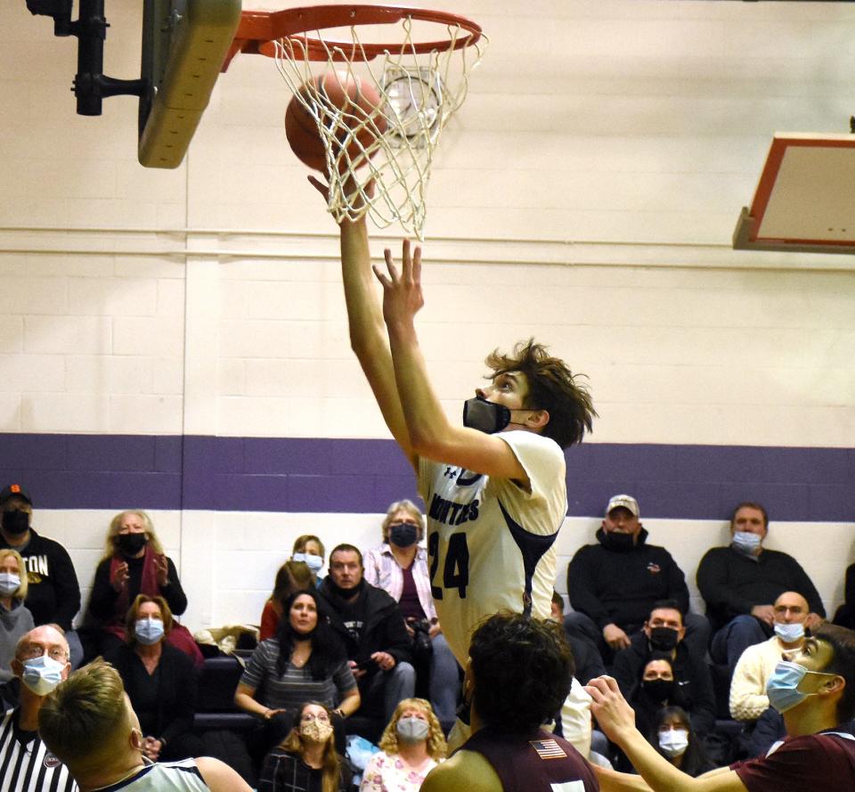 Little Falls Mountie Brayton Langdon (24) puts up a shot during the second half of Monday's game against Clinton.