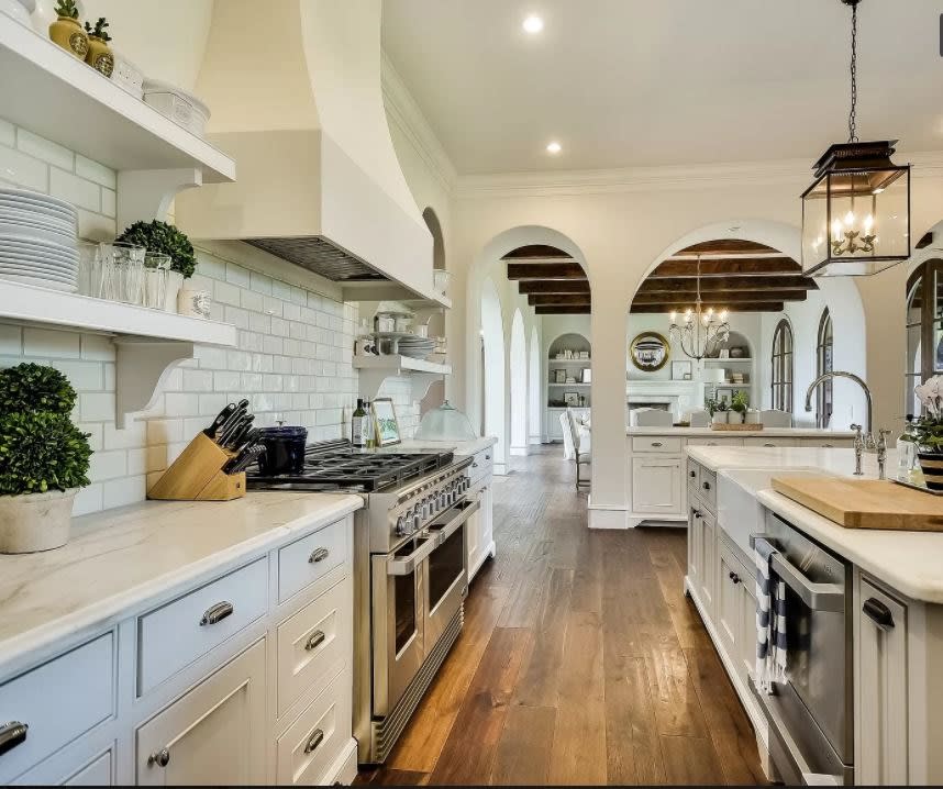 white dated kitchen with metro tiles