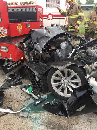 A Tesla Model S is seen after it hit the back of a mechanic truck from the Unified Fire Authority in this traffic collision in South Jordan, Utah, U.S., May 11, 2018. Picture taken May 11, 2018. South Jordan Police Department/Handout via REUTERS