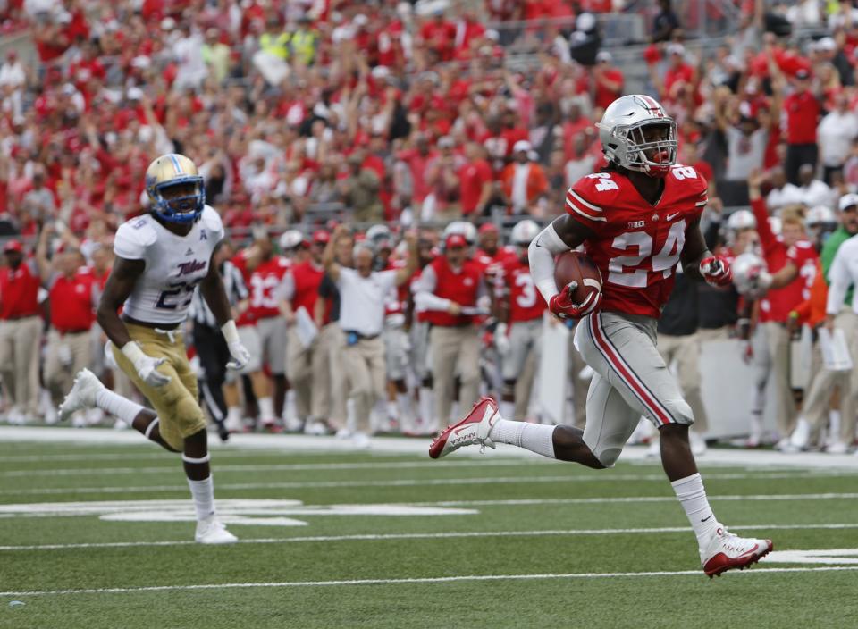 Ohio State S Malik Hooker (R) is a threat every time he intercepts a pass. (AP)