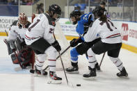 Toronto's Natalie Spooner, 24, battles Ottawa's Ashton Bell and Jincy Reese, 71, at the side of goalie Emerance Maschmeyer's net during the second period of a PWHL hockey game in Toronto, Sunday, May 5, 2024. (Frank Gunn/The Canadian Press via AP)