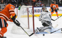 Los Angeles Kings goalie Jonathan Quick (32) makes the save on Edmonton Oilers' Leon Draisaitl (29) during the second period of an NHL hockey game in Edmonton, Alberta, Sunday, Dec. 5, 2021. (Jason Franson/The Canadian Press via AP)