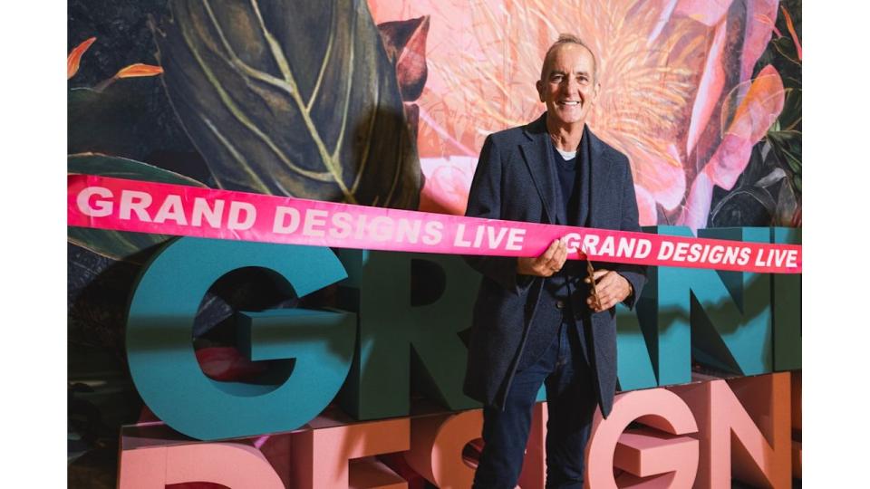 Kevin McCloud cutting a ribbon for Grand Designs Live