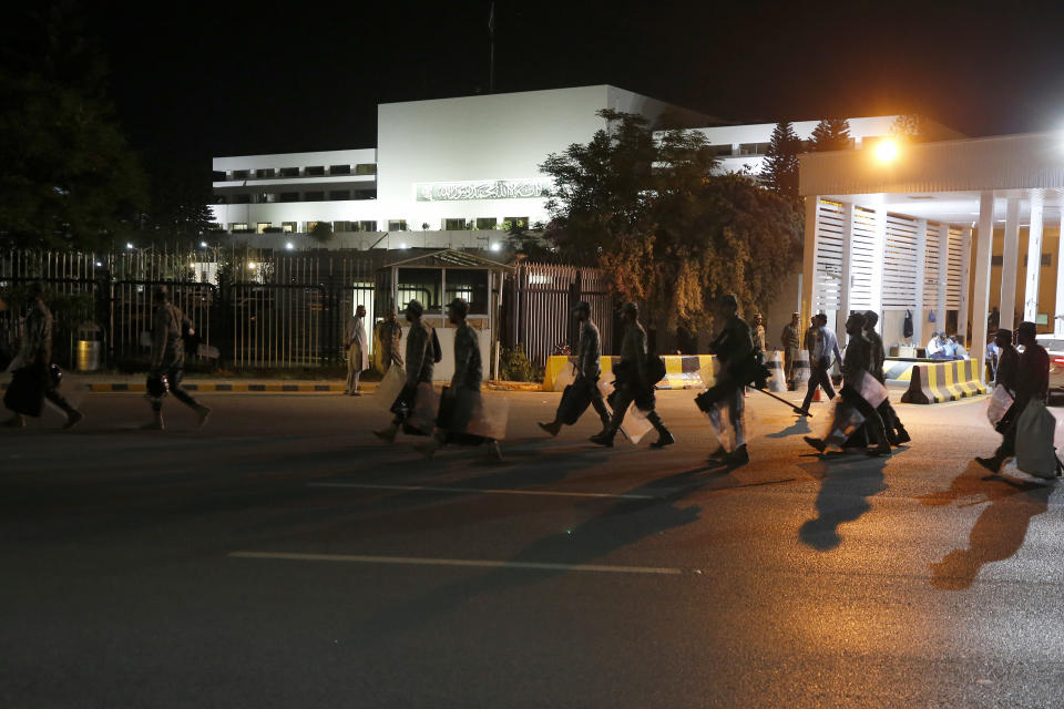 Pakistan's paramilitary troops arrive to take position outside the National Assembly, in Islamabad, Pakistan, Saturday, April 9, 2022. Pakistan's political opposition ousted the country's embattled prime minister in a no confidence vote on Saturday, which they won after several of Imran Khan's allies and a key coalition party deserted him. (AP Photo/Anjum Naveed)