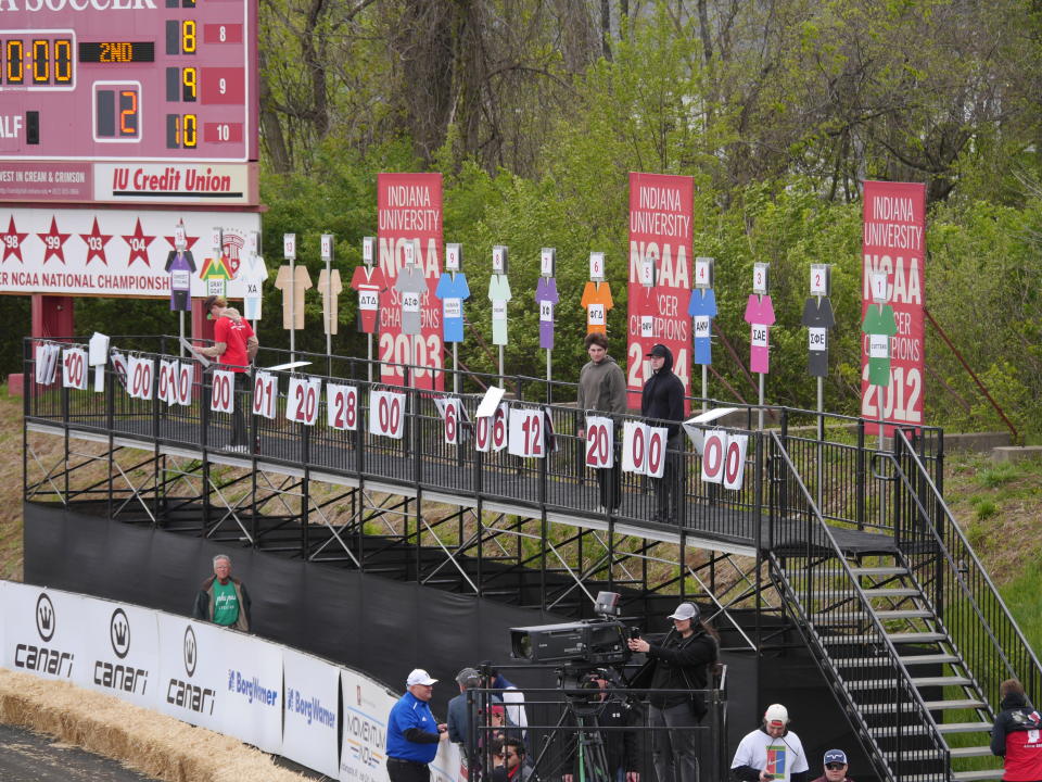 Oversized wooden jerseys and lap counters help the crowd follow the action of the race