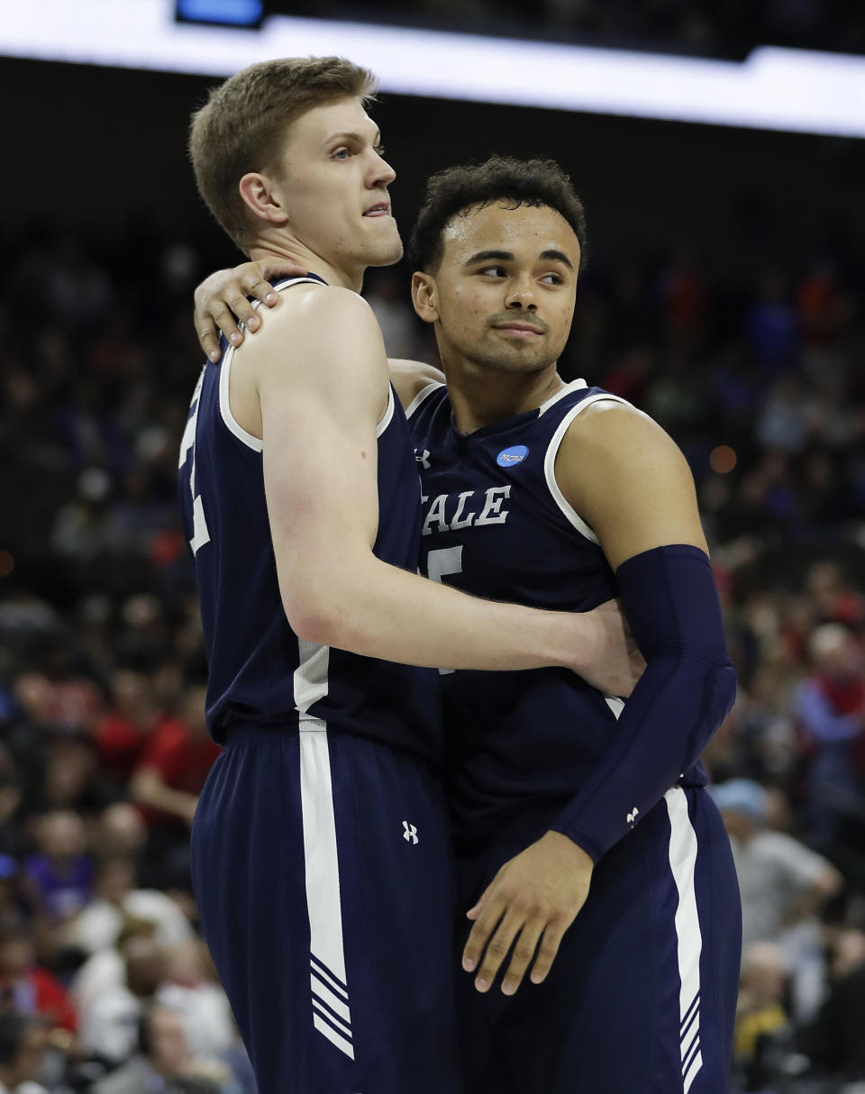 <p>Yale’s Blake Reynolds, left, and Azar Swain console each other after losing 79-74 to LSU in a first round men’s college basketball game in the NCAA Tournament, in Jacksonville, Fla. Thursday, March 21, 2019. (John Raoux/AP) </p>