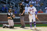 New York Mets' Francisco Lindor (12) reacts after he is intentionally walked to load the bases during the ninth inning of a baseball game against the Miami Marlins, Thursday, April 8, 2021, in New York. (AP Photo/John Minchillo)
