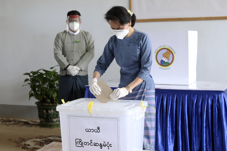 FILE - In this Thursday, Oct. 29, 2020 file photo, Myanmar's leader Aung San Suu Kyi casts her ballot early for the upcoming Nov. 8 general election at Union Election Commission office, in Naypyitaw, Myanmar. A major election monitoring organization says last November’s election results in Myanmar were representative of the will of the people, rejecting the military’s allegations of massive fraud that served as its justification for seizing power. ANFREL, the Asian Network for Free Elections, said in a 171-page report said procedural safeguards helped make the polling process transparent and reliable. (AP Photo/Aung Shine Oo, File)