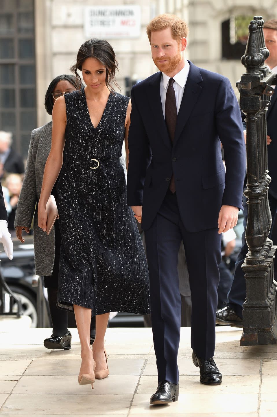 <p>Meghan decided to wear a navy and white printed Hugo Boss dress to attend the memorial service for Stephen Lawrence. Arm in arm with Hazza, Meghan matched the gown with nude court shoes and a silk clutch by <a href="https://www.wilburandgussie.com/collections/bespoke-charlie-build-a-bag/products/bespoke-charlie-oyster-silk-clutch" rel="nofollow noopener" target="_blank" data-ylk="slk:Wilbur and Gussie;elm:context_link;itc:0;sec:content-canvas" class="link ">Wilbur and Gussie</a>. </p>